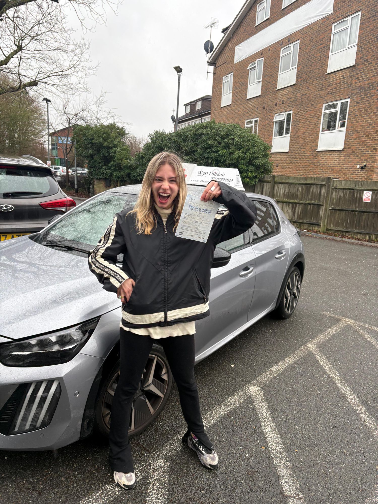 A West London Driving School learner celebrating their driving test pass